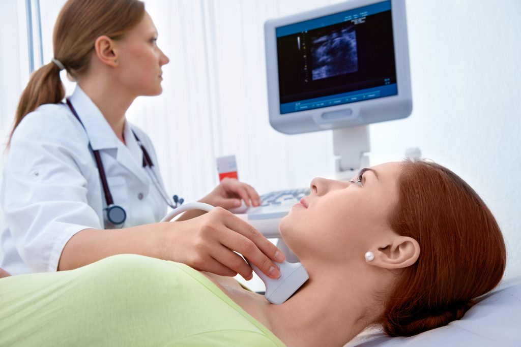 Photo of women receiving ultrasound test from nurse